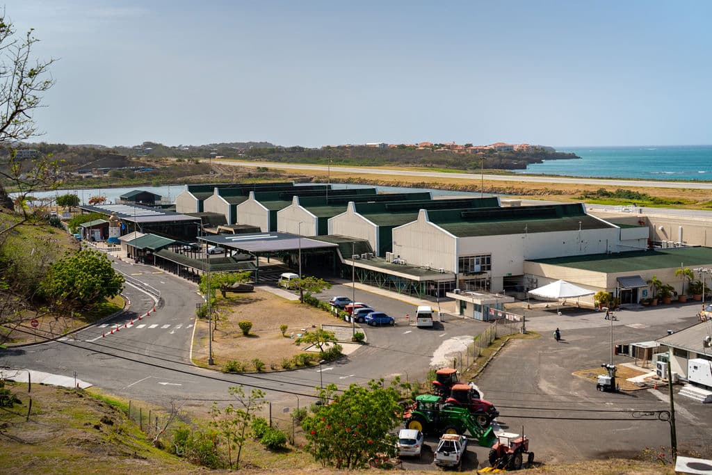 Maurice Bishop International Airport terminal with the Caribbean Sea beyond